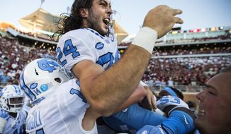 North Carolina players hoists kicker Nick Weiler on their shoulders after Weiler kicked the game winning 54-yard field goal against Florida State as time expired in an NCAA college football game in Tallahassee, Fla., Saturday, Oct. 1, 2016. North Carolina defeated Florida State 37-35 on a field goal. (AP Photo/Mark Wallheiser)