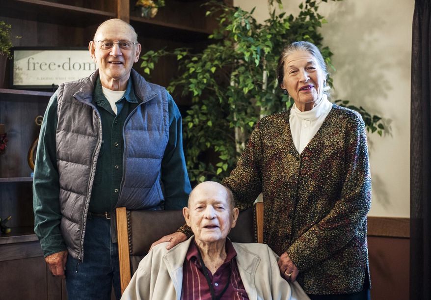 In this Thursday, Sept. 22, 2016 photo, from left, delegates to the 1972 Montana Constitutional Convention and Great Falls residents Bob Woodmansey, Don Rebal and Arlyne Reichert pose for a photo in Great Falls, Mont. What they produced was a ground-breaking document that was barely passed by voters amid heated debate, according to the Great Falls Tribune. (Julia Moss/The Great Falls Tribune via AP)