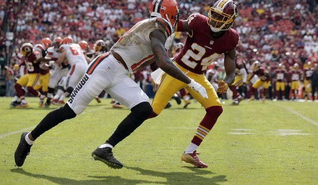 Cleveland Browns wide receiver Terrelle Pryor (11) is defended by Washington Redskins cornerback Josh Norman (24) during the second half of an NFL football game Sunday, Oct. 2, 2016, in Landover, Md. (AP Photo/Mark Tenally)