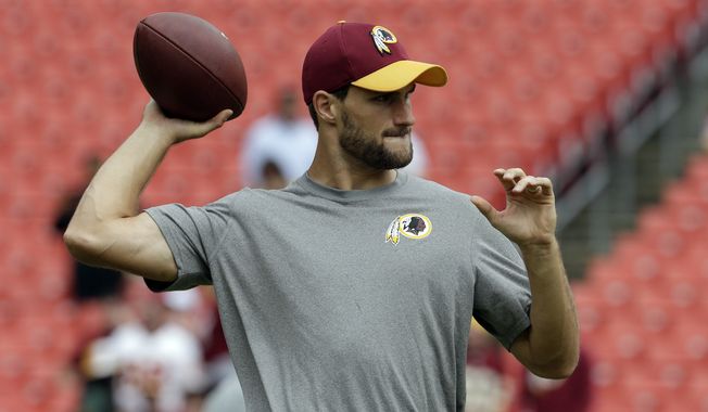 Washington Redskins quarterback Kirk Cousins (8) throws during warm ups before an NFL football game against the Cleveland Browns Sunday, Oct. 2, 2016, in Landover, Md. (AP Photo/Chuck Burton)