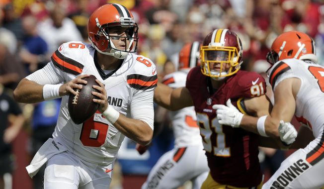 Cleveland Browns quarterback Cody Kessler (6) looks to pass under pressure from Washington Redskins outside linebacker Ryan Kerrigan (91) during the first half of an NFL football game Sunday, Oct. 2, 2016, in Landover, Md. (AP Photo/Chuck Burton)