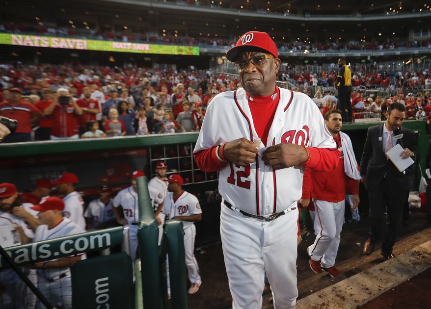 Washington Nationals manager Dusty Baker walks out of the dugout after the final out of a baseball game against the Miami Marlins at Nationals Park, Sunday, Oct. 2, 2016 in Washington. Nationals won 10-7. The NL East Champion Nationals, who will face Los Angeles in the division series, finished the regular season 95-67, a 12-game improvement in Baker&#39;s first season as manager. (AP Photo/Pablo Martinez Monsivais)