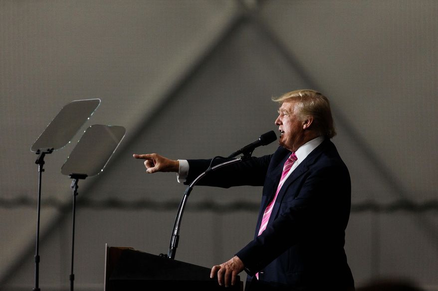 Republican presidential candidate Donald Trump finishes his speech at Spooky Nook Sports Complex in Manheim, Pa., Saturday, Oct. 1, 2016. (James Robinson/PennLive.com via AP)