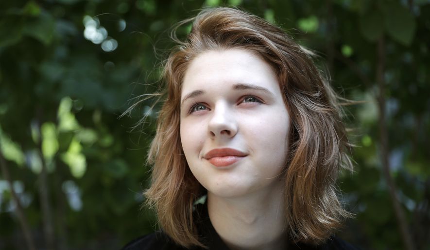 In this Sept. 7, 2016, photo, Jenn Brewer, 13, poses for a portrait after her monthly doctors appointment for monitoring of her treatment at Fort Belvoir Community Hospital in Fort Belvoir, Va. Brewer is transitioning from male to female. A new Pentagon policy brings some relief to transgender military retirees and children of active-duty service members. Starting Oct. 3, the military’s health insurance will cover transgender-related services that include hormone therapy and supportive counseling. (AP Photo/Jacquelyn Martin)
