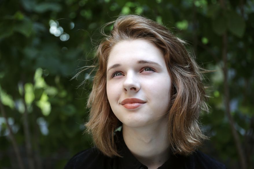 In this Sept. 7, 2016, photo, Jenn Brewer, 13, poses for a portrait after her monthly doctors appointment for monitoring of her treatment at Fort Belvoir Community Hospital in Fort Belvoir, Va. Brewer is transitioning from male to female. A new Pentagon policy brings some relief to transgender military retirees and children of active-duty service members. Starting Oct. 3, the military’s health insurance will cover transgender-related services that include hormone therapy and supportive counseling. (AP Photo/Jacquelyn Martin)