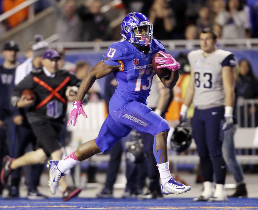 Boise State running back Jeremy McNichols runs for a touchdown after a reception against Utah State during the first half of an NCAA college football game against Saturday, Oct. 1, 2016, in Boise, Idaho. (Joe Jaszewski/Idaho Statesman via AP)