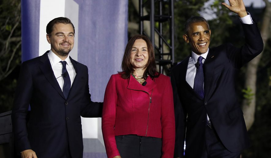 President Barack Obama, right, arrives with actor Leonardo DiCaprio, left, and Dr. Katharine Hayhoe, to talk about climate change as part of the White House South by South Lawn event on the South Lawn of the White House in Washington,Monday, Oct. 3, 2016. (AP Photo/Carolyn Kaster)