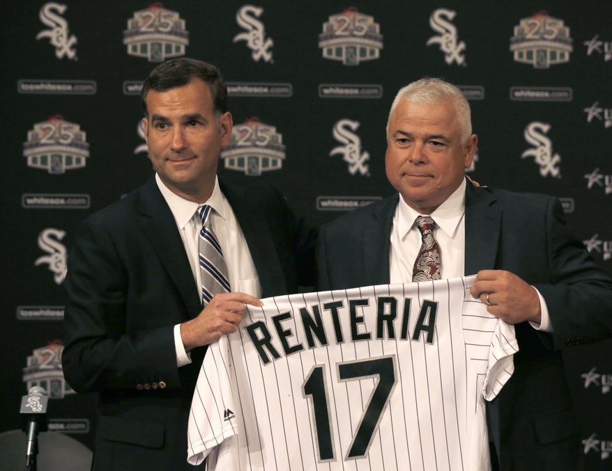 Chicago White Sox senior vice president and general manager Rick Hahn, left, poses with Rick Renteria after Hahn announced that Renteria will replace Robin Ventura as manager of the ball club during a baseball news conference Monday, Oct. 3, 2016, in Chicago. (AP Photo/Charles Rex Arbogast)