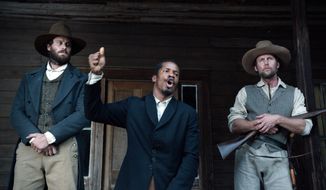 In this image released by Fox Searchlight Pictures, from left, Armie Hammer portrays Samuel Turner, Nate Parker portrays Nat Turner and Jayson Warner Smith portrays Earl Fowler in a scene from &quot;The Birth of a Nation,&quot; opening Oct. 7, 2016. (Fox Searchlight Pictures via AP)