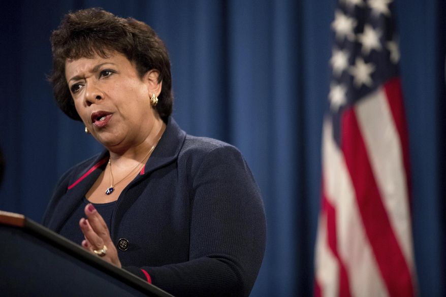 File- This Sept. 22, 2016, file photo shows Attorney General Loretta Lynch responding to a question during a news conference at the Justice Department in Washington. Lynch is announcing Justice Department grants Monday, Oct. 3, 2016, to help police departments across the country hire new officers. The $119 million in funding is being announced in Dallas, site of a sniper ambush in July that left five officers dead, at the start of National Community Policing Week. (AP Photo/Andrew Harnik, File)