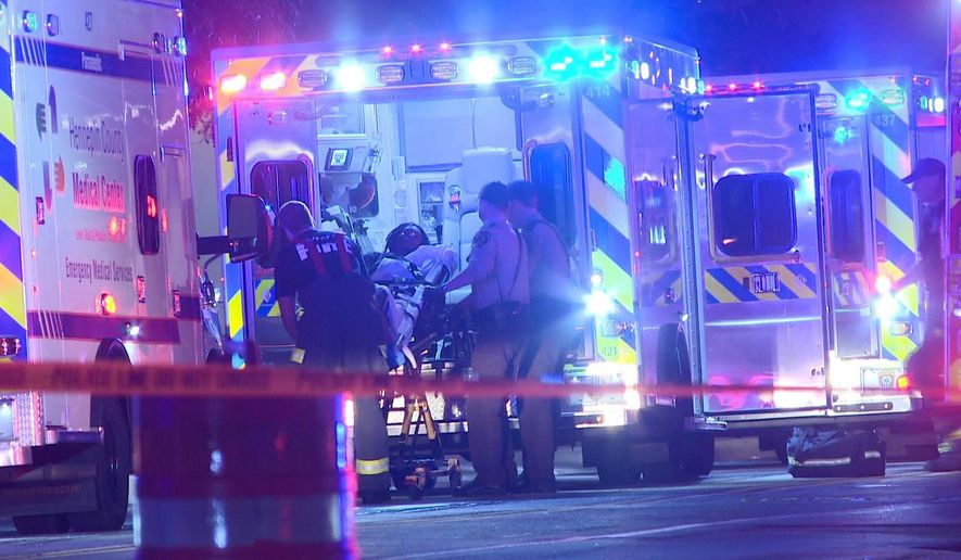 In this photo provided by KARE, a person is brought into an emergency vehicle after a shooting early Monday, Oct. 3, 2016, in Minneapolis. Minneapolis police said multiple people have been wounded in shootings in downtown Minneapolis. (KARE via AP)