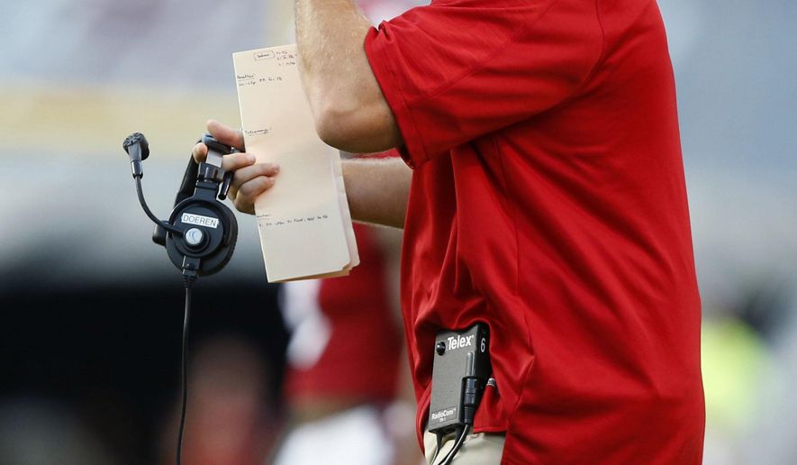 FILE - In this Sept. 17, 2016, file photo, North Carolina State head coach Dave Doeren argues a call during the first half of an NCAA college football game against Old Dominion at Carter-Finley Stadium in Raleigh, N.C. North Carolina State suddenly seems to have a penalty problem. The Wolfpack nearly doubled their flag total with 13 of them in beating Wake Forest. They know they can’t afford to be nearly that undisciplined when Notre Dame visits this week. (Ethan Hyman/The News & Observer via AP, File)
