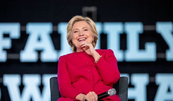 Democratic presidential candidate Hillary Clinton smiles while on stage at a town hall at the Haverford Community Recreation and Environmental Center in Haverford, Pa., Tuesday, Oct. 4, 2016. (AP Photo/Andrew Harnik)