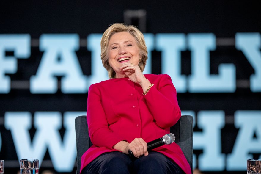 Democratic presidential candidate Hillary Clinton smiles while on stage at a town hall at the Haverford Community Recreation and Environmental Center in Haverford, Pa., Tuesday, Oct. 4, 2016. (AP Photo/Andrew Harnik)