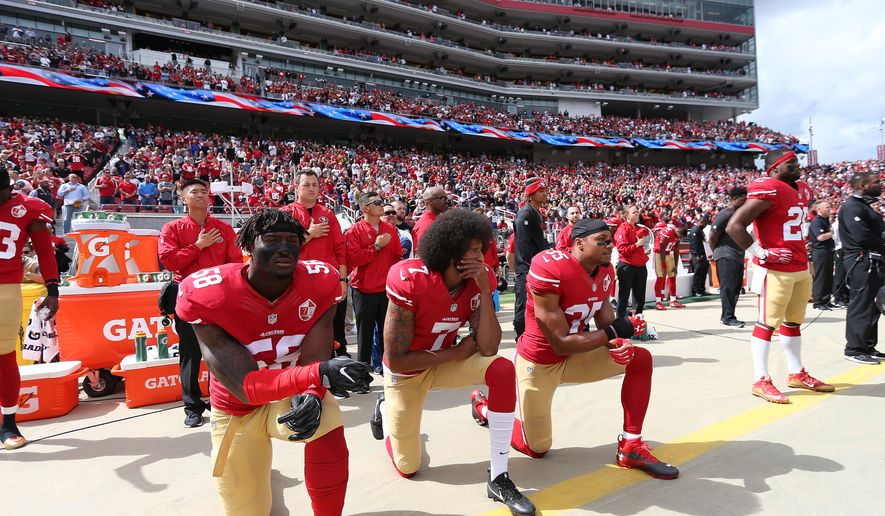San Francisco 49ers Eli Harold (58), Eric Reid (35) and Colin Kaepernick (7) take a knee during the National Anthem prior to action against the Dallas Cowboys during an NFL football game Saturday, Oct. 2, 2016, in Santa Clara, CA. The Cowboys won 24-17. (Daniel Gluskoter/AP Images for Panini)