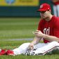 Washington Nationals second baseman Daniel Murphy changes his shoes during baseball batting practice at Nationals Park, Tuesday, Oct. 4, 2016, in Washington. The Nationals host the Los Angeles Dodgers in Game 1 of the National League Division Series on Friday. AP Photo/Alex Brandon)