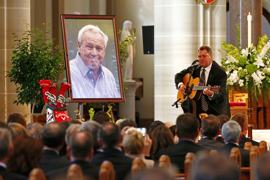 Country artist Vince Gill performs during a memorial service for golfer Arnold Palmer in the Basilica at St. Vincent's College in Latrobe, Pa., Tuesday, Oct. 4, 2016. (AP Photo/Gene J. Puskar)