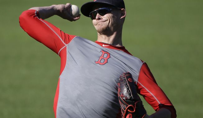 Boston Red Sox pitcher Clay Buchholz throws during a baseball team workout at Fenway Park, Tuesday, Oct. 4, 2016, in Boston, as they prepare for Game 1 of the  American League Division Series scheduled for Thursday in Cleveland. (AP Photo/Elise Amendola)
