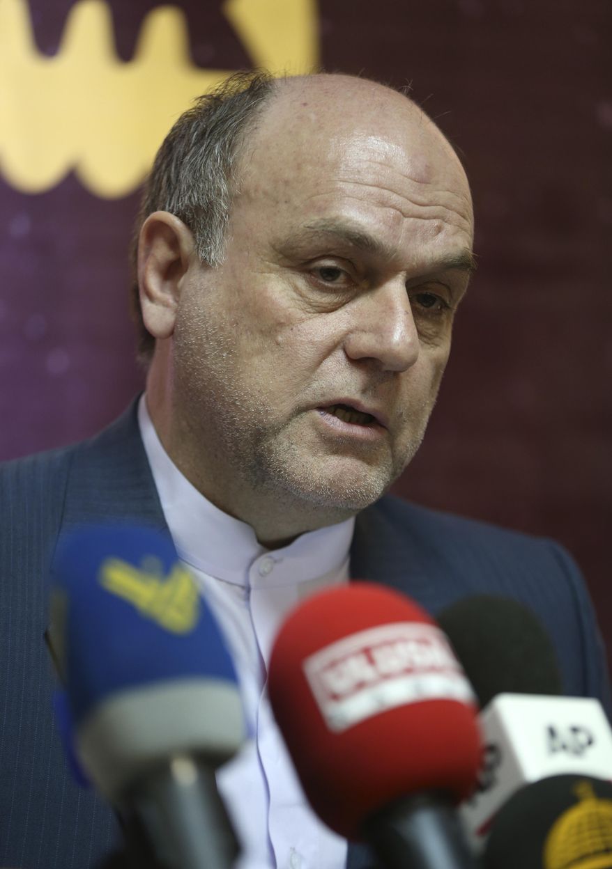 The head of Iran's space agency, Mohsen Bahrami, speaks during a news conference at his office, in Tehran, Iran, Tuesday, Oct. 4, 2016. Speaking to reporters at the start of World Space Week, Bahrami said his country is interested in cooperating with NASA. Iran has long harbored ambitions to launch satellites to monitor natural disasters in the earthquake-prone nation. The U.S. and its allies are concerned the same technology could be used to develop long-range missiles. (AP Photo/Vahid Salemi)