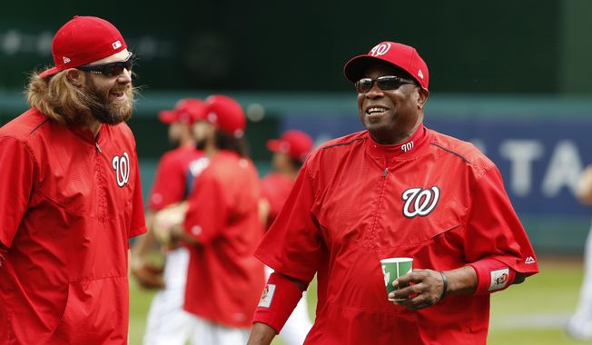 Washington Nationals left fielder Jayson Werth, left, and manager Dusty Baker share a laugh during baseball batting practice at Nationals Park, Tuesday, Oct. 4, 2016, in Washington. The Nationals host the Los Angeles Dodgers in Game 1 of the National League Division Series on Friday. AP Photo/Alex Brandon) **FILE**