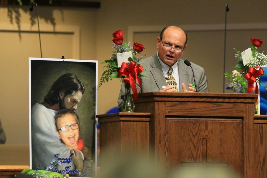 Tim Marcengill, Associate Pastor Evangelism and Education, speaks at funeral for Jacob Hall at Oakdale Baptist Church on Wednesday, Oct. 5, 2016, in Townville, S.C. Jacob's family has encouraged people to celebrate his life by dressing as the superheroes he loved. A 14-year-old boy killed his own father, then drove to Townville Elementary and fired on two children and a teacher as recess began. Jacob died Saturday. ( Ken Ruinard/The Independent-Mail via AP, Pool)