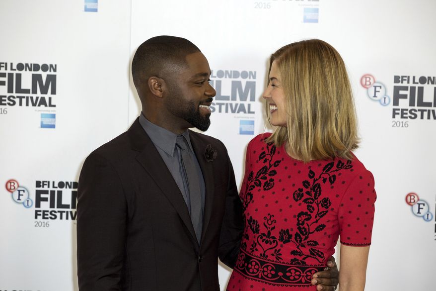 Actors David Oyelowo and Rosamund Pike pose for photographers at the photo call for the film 'A United Kingdom', which opens the London Film Festival in London, Wednesday, Oct. 5, 2016. The festival runs from Oct. 5 until Oct. 16. (Photo by Grant Pollard/Invision/AP)