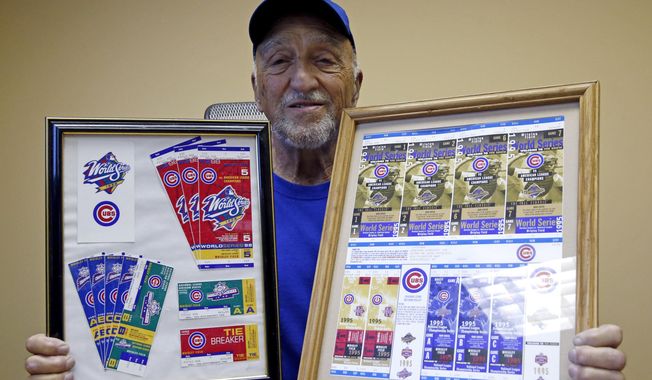 In this Saturday, Oct. 1, 2016, photo, Chicago Cubs fan Nick Paolella, 81, shows off his Cubs collection at his office in Roselle, Ill. It has been 108 years since the North Siders last won the World Series, beating the Detroit Tigers in five games in 1908. Now one of the best Cubs teams in decades is looking to pour champagne on one of sports’ most famous droughts, and its devoted fans are watching with a mixture of excitement and foreboding dread generated by years of heartache. (AP Photo/Nam Y. Huh)