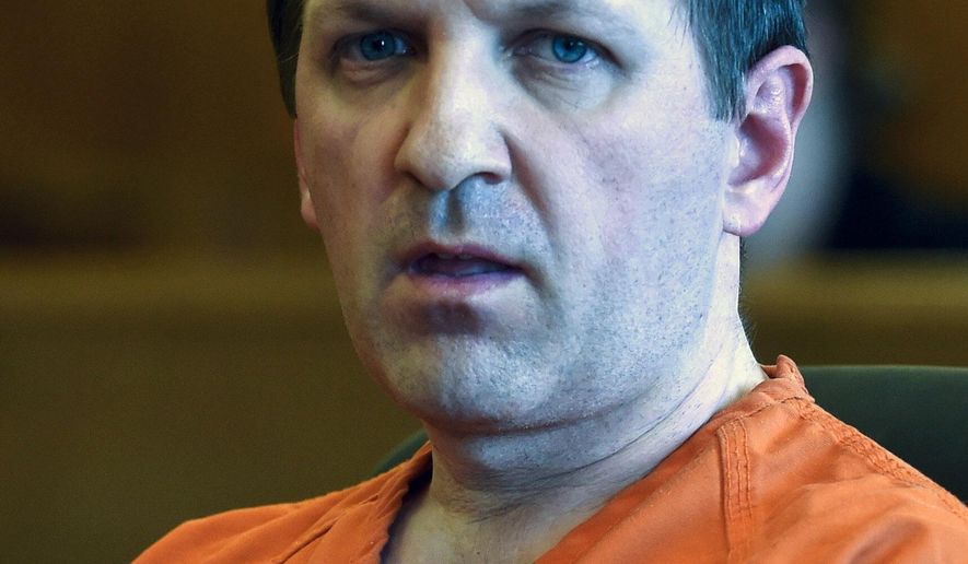 Cristian Loga-Negru, 40, listens to Racine County Circuit Judge Eugene Gasiorkiewicz during his sentencing hearing, Wednesday, Oct, 5, 2016, in Racine, Wis. Cristian Loga-Negru was sentenced Wednesday to life in prison for killing his estranged wife with a hatchet after she tried to hide from him in Wisconsin. (Gregory Shaver/The Journal Times via AP)