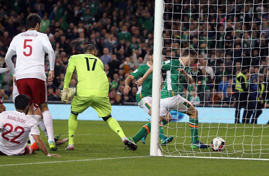 Republic of Ireland's Seamus Coleman scores his side's first goal of the game during their World Cup 2018 Group D qualifying soccer match against Georgia at the Aviva Stadium, Dublin, Thursday, Oct. 5, 2016. (Brian Lawless/PA via AP)