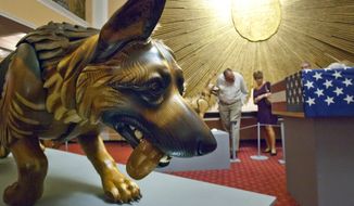 James Mellick&#39;s ArtPrize entry &amp;quot;Wounded Warrior Dogs&amp;quot; at the Amway Grand Plaza Hotel in Grand Rapids on Sunday, Sept. 25, 2016. (Cory Morse/The Grand Rapids Press via AP)