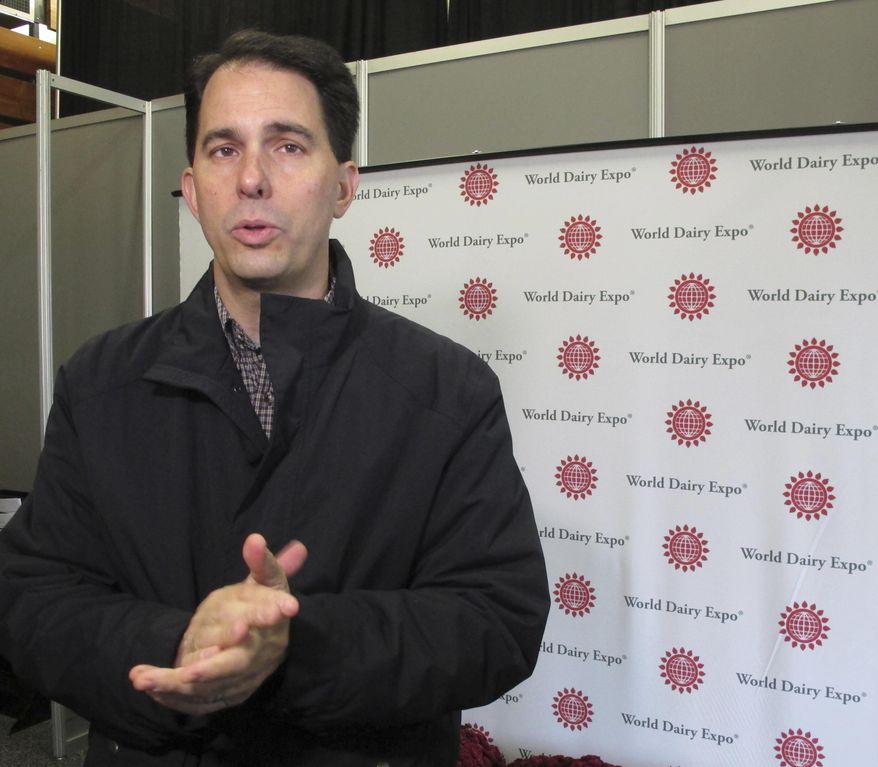 Wisconsin Gov. Scott Walker speaks to the media, Friday, Oct. 7, 2016, in Madison, Wis. Walker says the state Department of Justice found problems with how Wisconsin's voter ID law was being administered during spot checks at Division of Motor Vehicle driver's license stations. (AP Photo/Scott Bauer)
