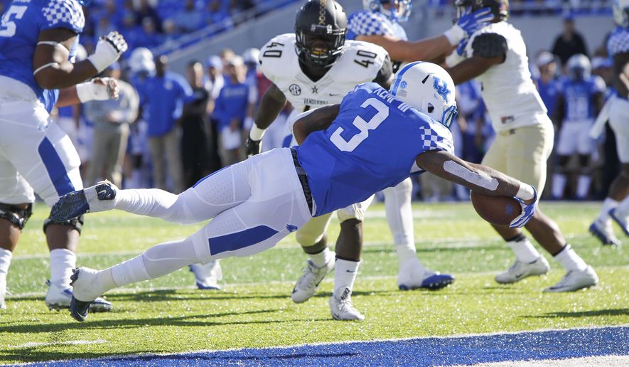 Kentucky running back Jojo Kemp (3)dives into the end zone for a touchdown in the first half of an NCAA college football game against Vanderbilt, Saturday, Oct. 8, 2016, in Lexington, Ky. (AP Photo/David Stephenson)