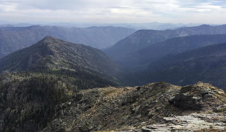This August 2016 photo, shows the view into the Bunker Creek dranage from the Swan Ridge Alpine Trail near Swan Lake, Mont. For outdoor enthusiasts traversing the southern section of the Alpine 7 Trail atop the Swan Mountain Range, the Daily Inter Lake reported, even a smoky day opens up sweeping views of the Swan Valley. (Sam Wilson/The Daily Inter Lake via AP)