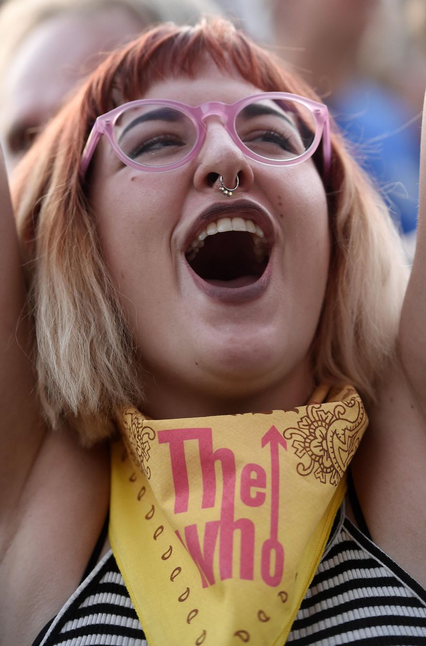 Caitllin Cardinale of Los Angeles reacts to the arrival of The Who onstage on day 3 of the 2016 Desert Trip music festival at Empire Polo Field on Sunday, Oct. 9, 2016, in Indio, Calif. (Photo by Chris Pizzello/Invision/AP)