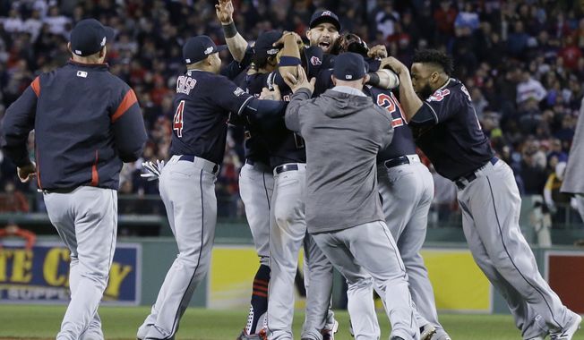 The Cleveland Indians celebrate their 4-3 win over the Boston Red Sox in Game 3 of baseball's American League Division Series, Monday, Oct. 10, 2016, in Boston. (AP Photo/Elise Amendola)
