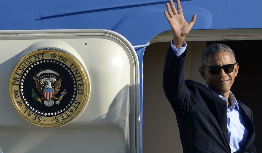 President Barack Obama waves while boarding Air Force One before leaving O&#39;Hare International Airport Sunday, Oct. 9, 2016, in Chicago. (AP Photo/Paul Beaty)