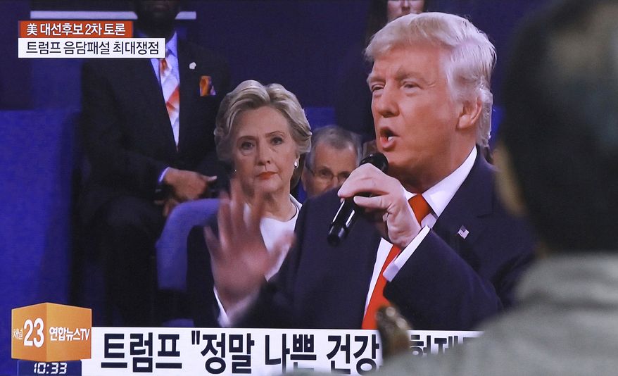The presidential debate between Democrat Hillary Clinton and Republican Donald Trump on Sunday was broadcast live in South Korea. (Associated Press)