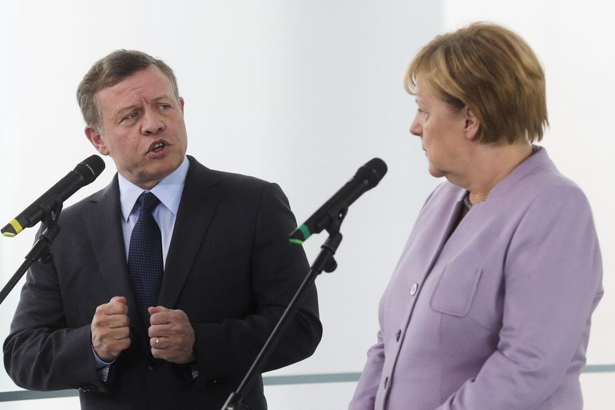 German Chancellor Angela Merkel, right, and King Abdullah II, of Jordan, brief the media prior to talks at the chancellery in Berlin, Friday, Oct. 7, 2016. (AP Photo/Markus Schreiber)