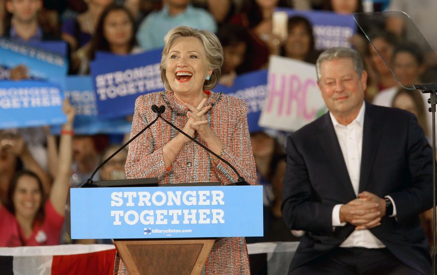 Democratic presidential candidate Hillary Clinton, is joined at a rally with former Vice President Al Gore at Miami Dade College in Miami, Tuesday, Oct. 11, 2016. (Mike Stocker/South Florida Sun-Sentinel via AP) **FILE**