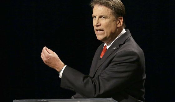 North Carolina Republican Gov. Pat McCrory makes a comment while participating in a live televised gubernatorial debate with Democratic challenger Attorney General Roy Cooper at UNC-TV studios in Research Triangle Park, N.C., Tuesday, Oct. 11, 2016. (AP Photo/Gerry Broome, Pool)