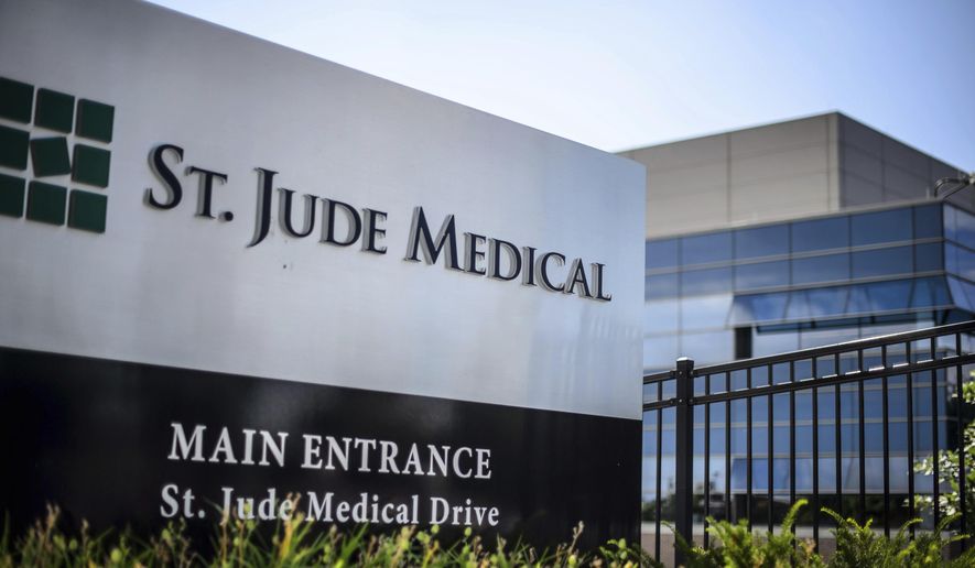 FILE - This Wednesday, July 22, 2015, file photo shows St. Jude Medical corporate headquarters, in Little Canada, Minn., just north of St. Paul. Medical device maker St. Jude Medical is warning doctors and patients about a rare battery defect in some of its implantable heart devices that can cause them to fail much earlier than expected. The company said Tuesday, Oct. 11, 2016, the batteries should be replaced immediately after patients receive an electronic, vibrating alert from the device. Normally patients have up to three months to have batteries replaced. But the company said a small subset of its heart-shocking defibrillators can fail within 24 hours of the alert. (Glen Stubbe/Star Tribune via AP, File)