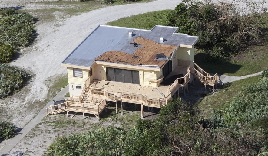 This Saturday, Oct. 8, 2016 photo provided by NASA shows damage to the roof of the Beach House during an aerial survey of the Kennedy Space Center in Florida. Hurricane Matthew passed to the east of the state on Oct. 6 and 7, 2016. (Cory Huston/NASA via AP)