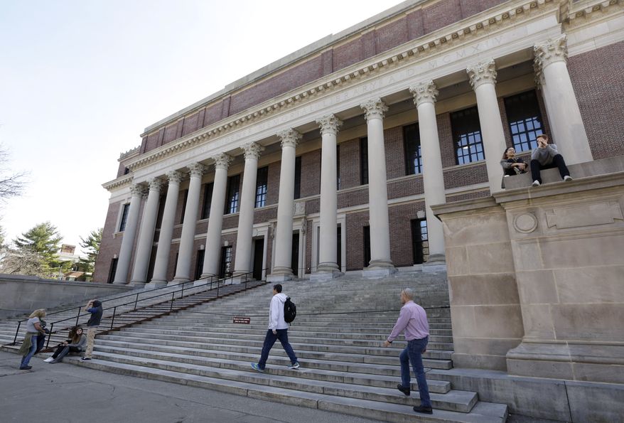 People gather in front of Widener Library on the campus of Harvard University in Cambridge, Mass. (Associated Press)