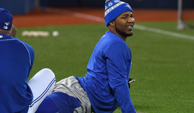 Toronto Blue Jays Edwin Encarnacion warms up during practice in Toronto, Tuesday, Oct. 11, 2016. The Blue Jays face the Cleveland Indians in Game 1 of the American League Championship Series Friday in Cleveland. (Frank Gunn/The Canadian Press via AP)