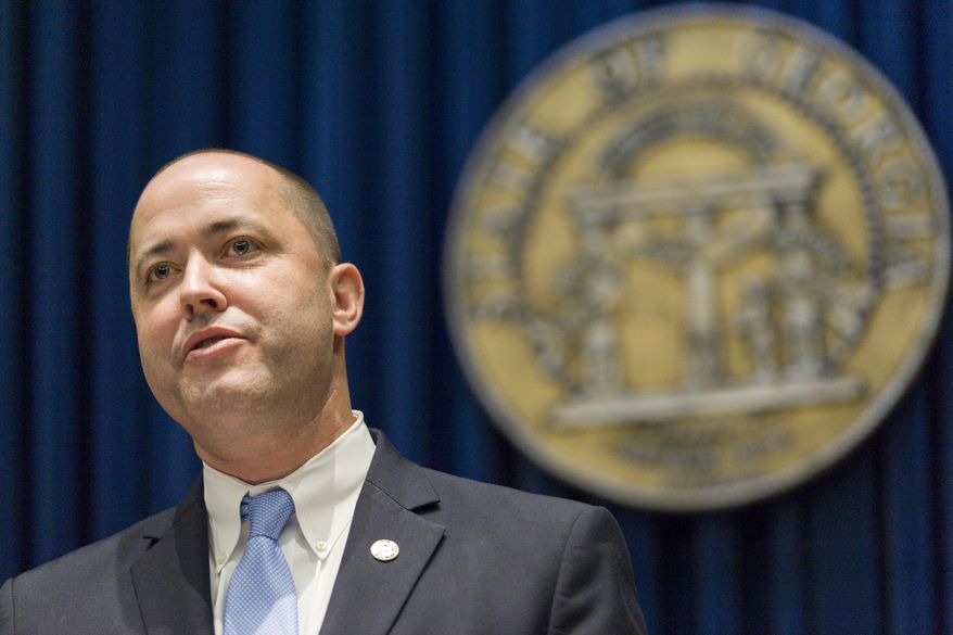 Chris Carr responds to a reporters' question during a press conference where he was appointed the next attorney general following the Board of Regents vote to hire current Attorney General Sam Olens as president of Kennesaw State University, in Atlanta, on Wednesday, Oct. 12, 2016. Carr will take his new position on November 1. (David Alexander Barnes /Atlanta Journal-Constitution via AP)