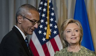 Clinton campaign chair John Podesta with Democratic presidential candidate Hillary Clinton in New York, Monday, Sept. 19, 2016. (AP Photo/Matt Rourke)