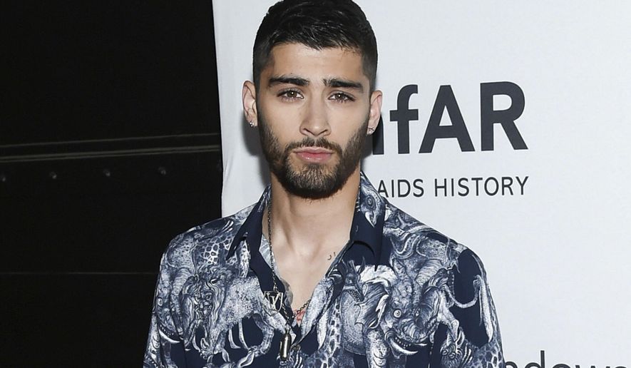 FILE - In this June 9, 2016 file photo, singer Zayn Malik attends the amfAR Inspiration Gala honoring Naomi Campbell and Kim Jones in New York. Malik will debut his Zayn X Versus capsule collection for men and women in May. He&#39;ll also appear in the Versus label&#39;s next two ad campaigns, starting in February. (Photo by Evan Agostini/Invision/AP, File)
