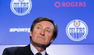 Wayne Gretzky attends a press conference announcing he will be re-joining the NHL hockey club in an off-ice role Wednesday Oct. 12, 2016, in Edmonton, Albera. (Amber Bracken/The Canadian Press via AP)