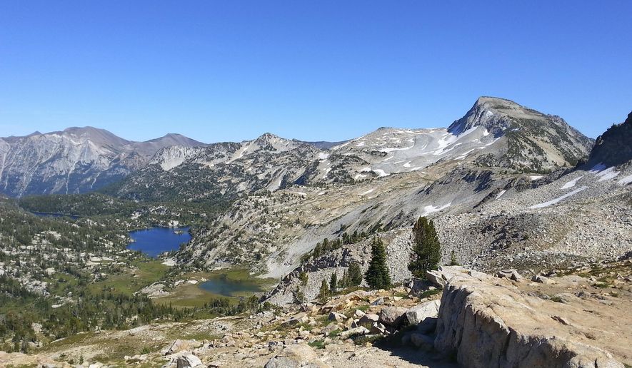 ADVANCE FOR USE SATURDAY, OCT. 15 - In this Aug. 20, 2016 photo, Mirror Lake, the larger lake in the left center, in the Lake Basin of the Eagle Cap Wilderness area is seen in the distance near Joseph, Ore. Eagle Cap peak is at the far right. (Lisa Bratton/Baker City Herald via AP)