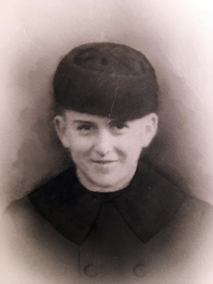 This undated photo provided by the family of Navy Fireman 3rd Class Edwin Hopkins of Keene, N.H., shows Hopkins in his uniform. Hopkins was one of the men who died when the USS Oklahoma was sunk in Pearl Harbor, Hawaii in Dec. 7, 1941. His remains have recently been positively identified and will be returned to New Hampshire to be buried next to his parents in his hometown. (Courtesy of the family of Navy Fireman 3rd Class Edwin Hopkins via AP)